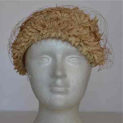 Daisy covered casque with rhinestone centers and net veil