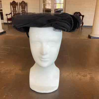 Velvet pancake style cocktail hat with tulle edging and jet bead detailing