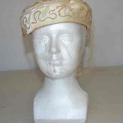Satin rounded pillbox with beads, sequins and veiling
