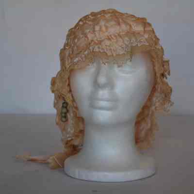 Ruffled boudoir cap with lace trim and small beads on front