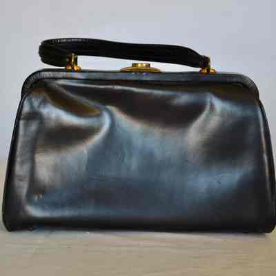 Soft leather flap bag with gold clasp, leather handle