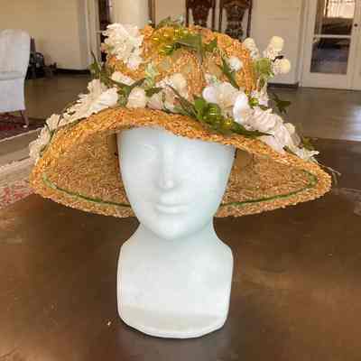 Braided straw flowerpot hat with floral and grape embellishment