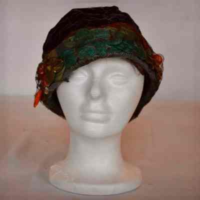 Velvet brimless hat with gold netting covered faux flowers