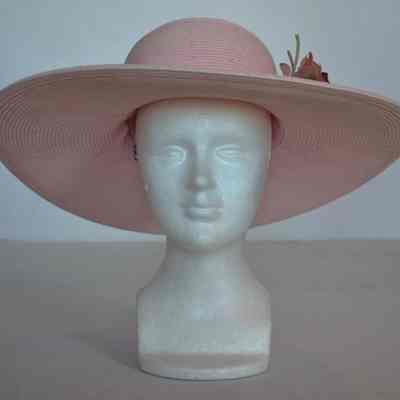 Pink wide brimmed hat with large pink rose
