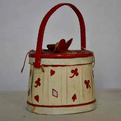 Drum style purse with deck of card cutout motifs, balsa wood with red leather, hinged lid