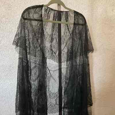 Black lace cape with shawl collar and arm openings
