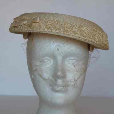 Straw mushroom style hat with net veil