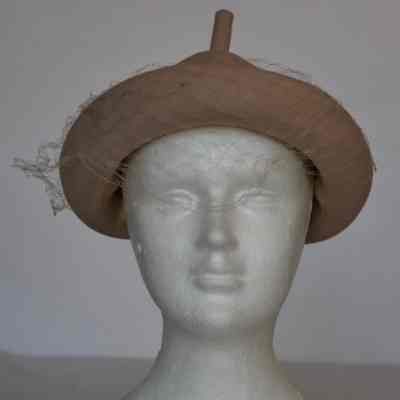 Rimmed Hershey’s Kisses style hat with netting