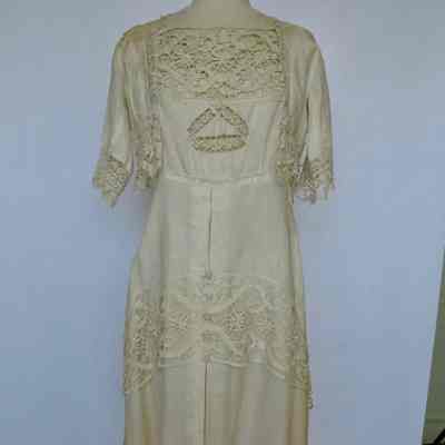 Short sleeve full length dress with lace yoke, bodice insertand trim and square neck