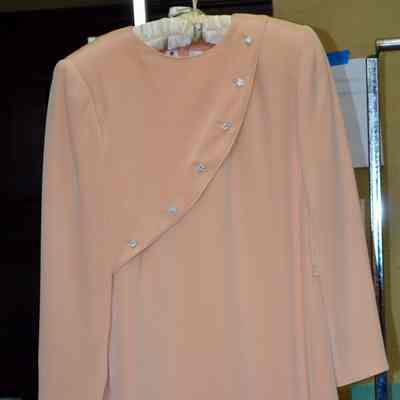 Shift with diagonal bodice panel with rhinestone buttons and long padded sleeves