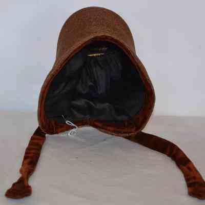 Straw child's bonnet with velvet ties