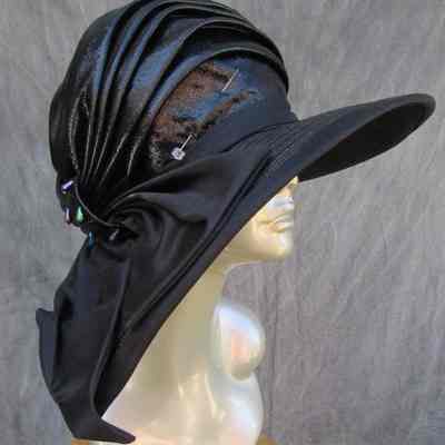 Black cloche with wide rim covered in black satin