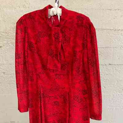 Printed dress with self tie collar, long sleeves and inverted pleats