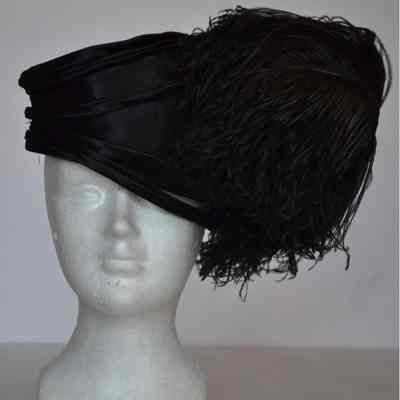 Black satin toque with ostrich feather