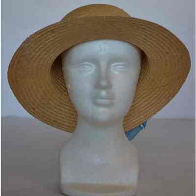Straw brimmed hat with large blue flower