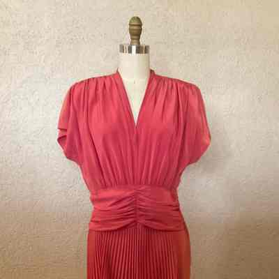 V-neck mid-calf length dress with grown on sleeves and knife pleated skirt
