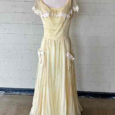Wide neck full length dress with daisy embellishment on shawl collar and pockets