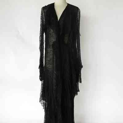 Black long sleeve long lace dress with draped collar and surplice front
