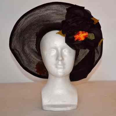 Velvet crown and large horsehair brim with floral trim on inside and outside brim