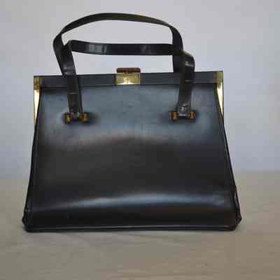 Leather rigid bag, lined in soft leather, self handle, gold hardware, clasp