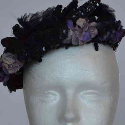 Embellished calot with purple faux flowers