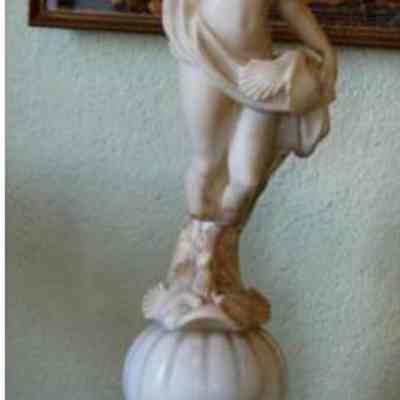 Sculpture of standing female nude on pedestal