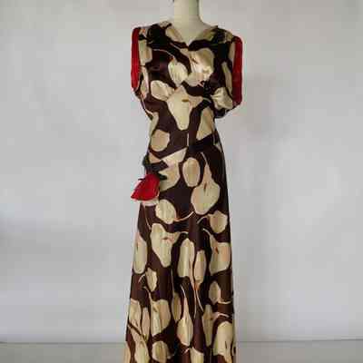 V neck bias long calla lily dress with self belt and red cuffs on sleeve opening
