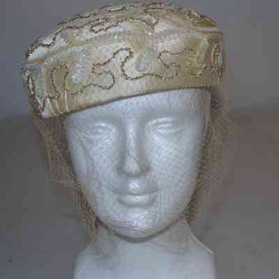 Satin rounded pillbox with beads, sequins and veiling