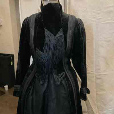 Long sleeve velvet coat with tie neck and passementerie embellishment