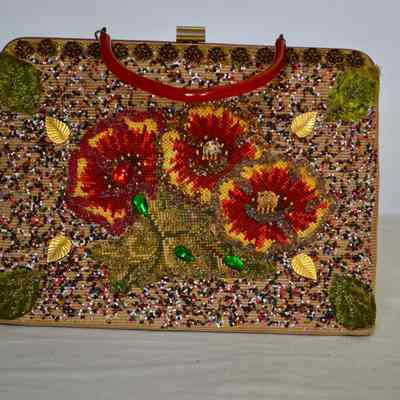 Purse with multicolor beading, needlepoint, cabochon applique, metal leaves, amber Bakelite handle,