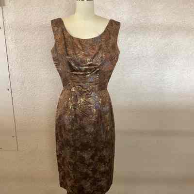 Metallic print sleeveless cocktail dress with bow at front waist