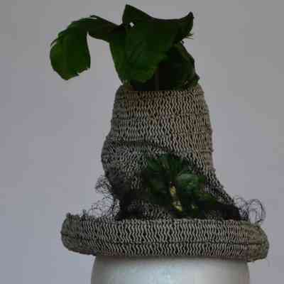 Robin Hood style hat with netting and green feathers