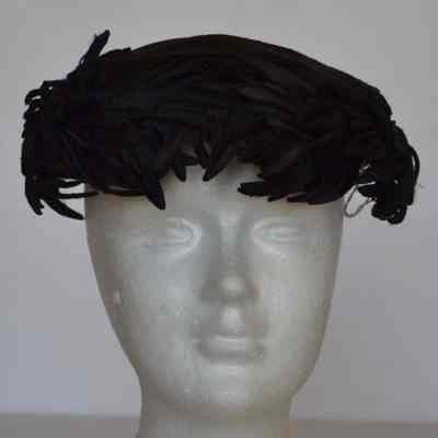 Velour casque with feathered self and silk additions