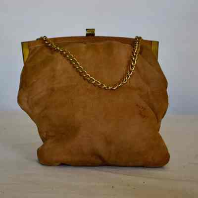 Suede soft purse with gold chain, framed with gold tone hardware