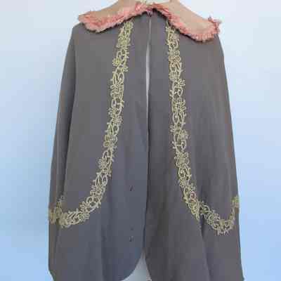 Wool cape with pink silk collar and cream lace trim