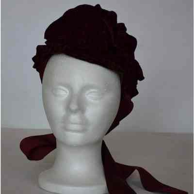 Small velvet ruffled bonnet with thick grosgrain ties
