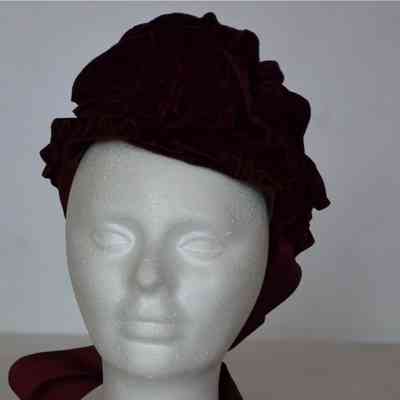 Small velvet ruffled bonnet with thick grosgrain ties