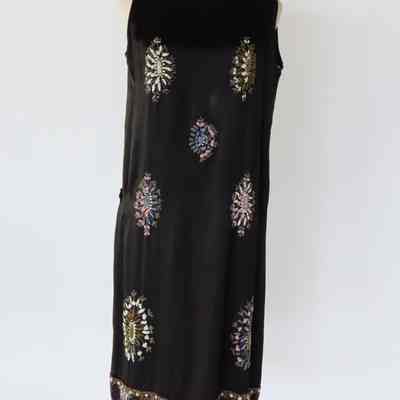 Sleeveless charmeuse drop waist tabard style dress, belted with seed beading floral on front and back and beaded hem band