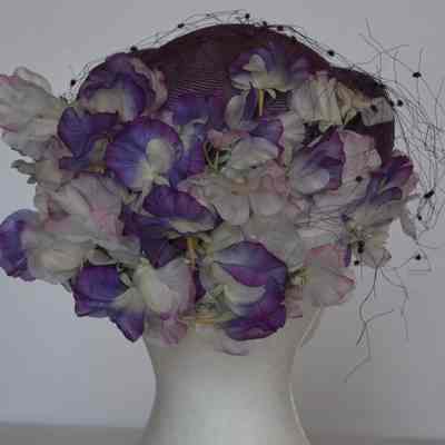 Purple Straw Hat with netting veil and faux flowers