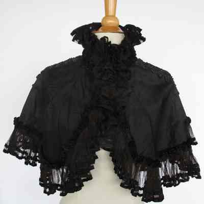 Capelet with beading along shoulders and pleated netting and high collar