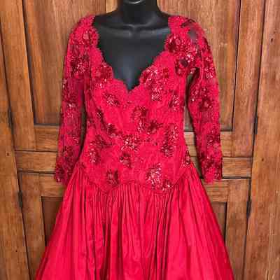 Ball gown with beaded V-neck bodice and 3/4 sleeve, full skirt