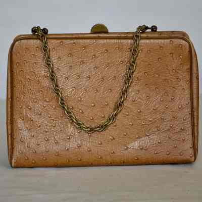 Embossed vinyl bag in ostrich pattern, gold tone hardware and chain strap