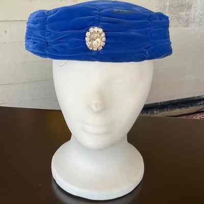 Blue velvet pillbox cocktail hat with rhinestone cabachon