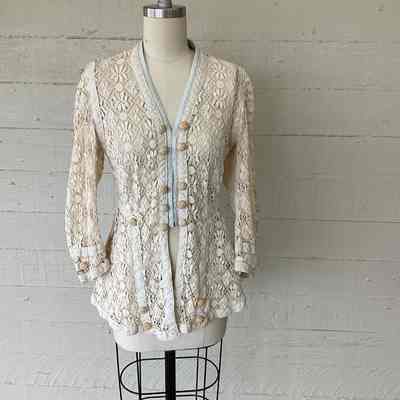 Crochet lace jacket with hook front and cotton banding and decorative crochet buttons