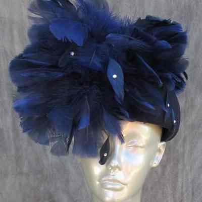 Blue pillbox covered in feathers