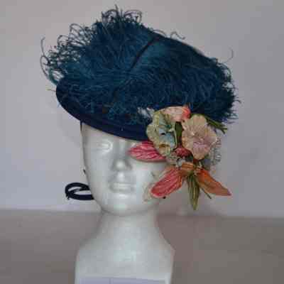 Felt hat with ties, faux flowers and large plume