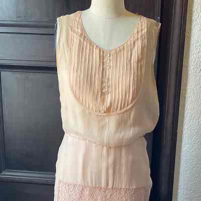 Sleeveless chiffon dress with bib front and lace paneled skirt