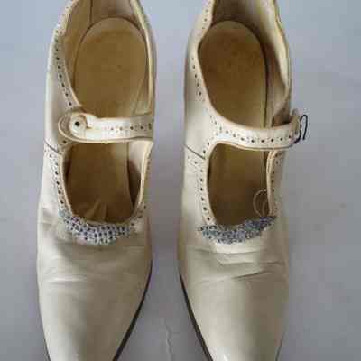 Cream Leather Mary Jane with Rhinestone Pin at Vamp, Louis Heel and Punched Design around edges, Pearl Button Closure on Strap