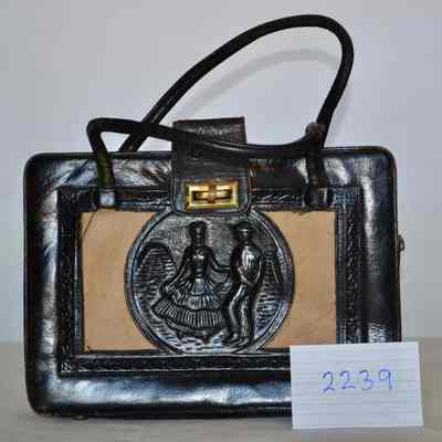 Embossed or tooled leather bag, with pony fur insert, fold over gold toggle clasp, zip bag, double strap