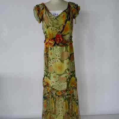 Long floral chiffon dress with cowl neck, smocked cap sleeves, faux flower embellishment at waist, smocked and gathered flounce